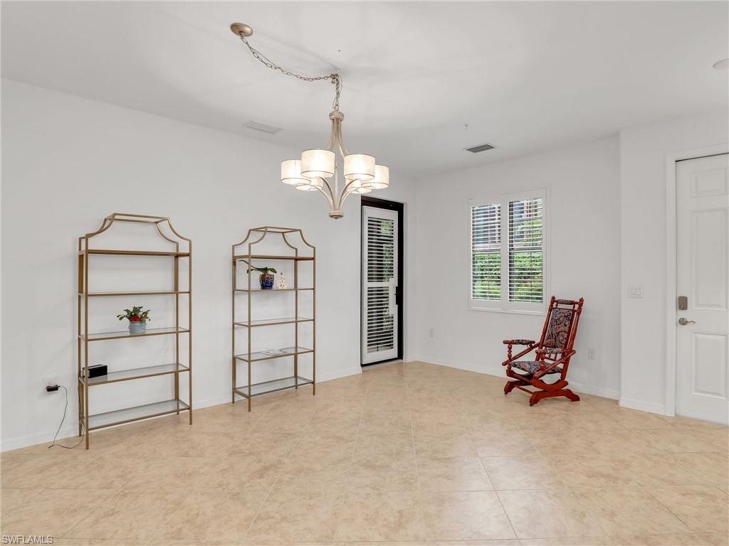9066 Albion Lane North, Unit 5103 Naples, FL 34113 - Photo 6 of 40 a view of a livingroom with furniture and a window