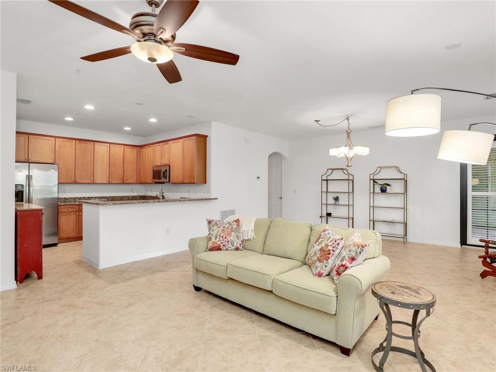 9066 Albion Lane North, Unit 5103 Naples, FL 34113 - Photo 9 of 40 a living room with granite countertop furniture and kitchen view