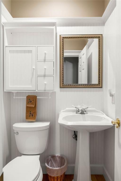 704 Riverbend Road Blairsville, GA 30512 - Photo 60 of 89 a bathroom with a toilet a sink and mirror