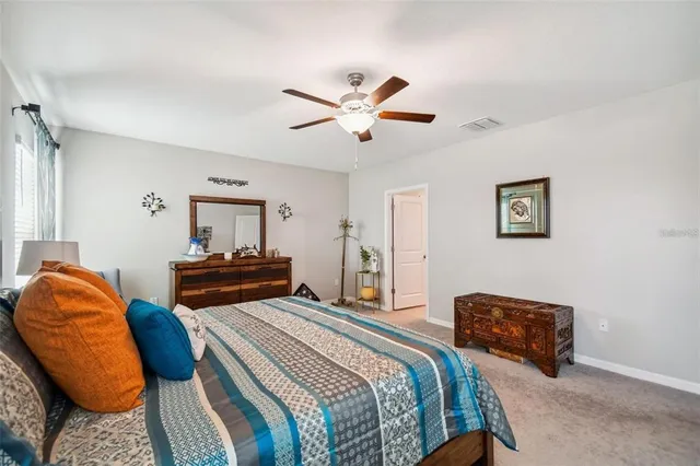 a bedroom with two beds and a couch