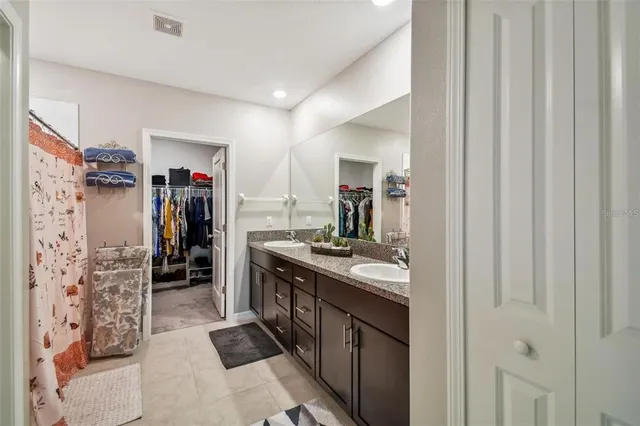 a kitchen with stainless steel appliances granite countertop a refrigerator and a stove