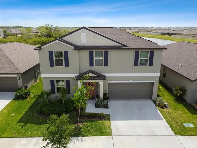 a aerial view of a house with a yard