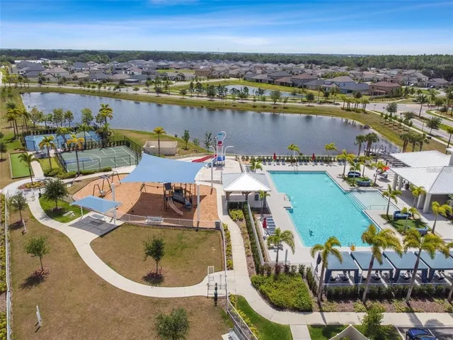an aerial view of a house with a ocean view