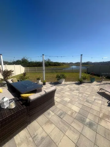 a view of a swimming pool with a lounge chairs