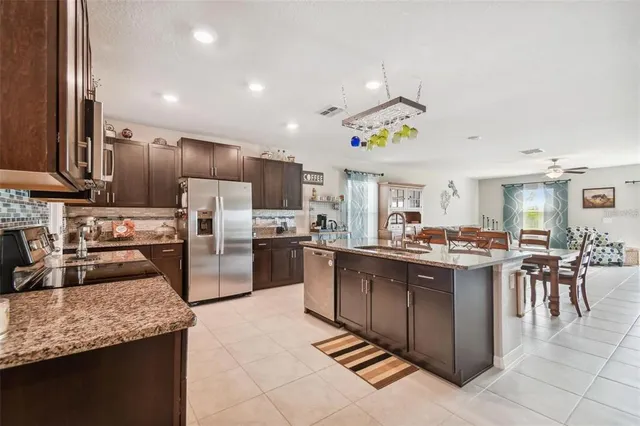 a kitchen with lots of counter top space and appliances