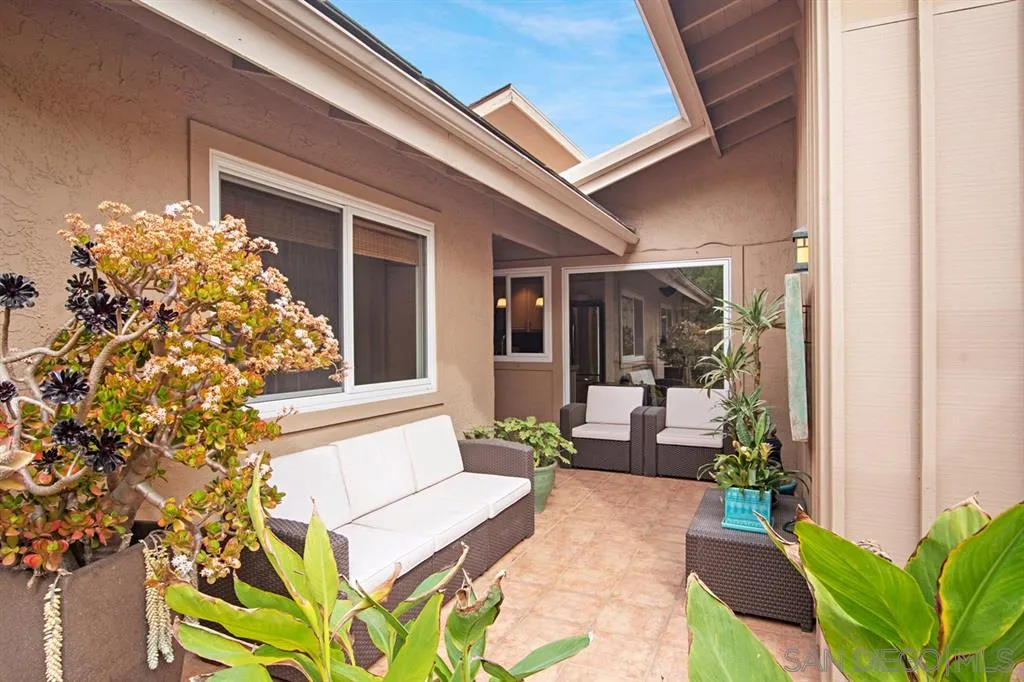 2224 Caminito Cabala La Jolla, CA 92037 - Photo 14 of 36 a view of a porch with chairs and potted plants