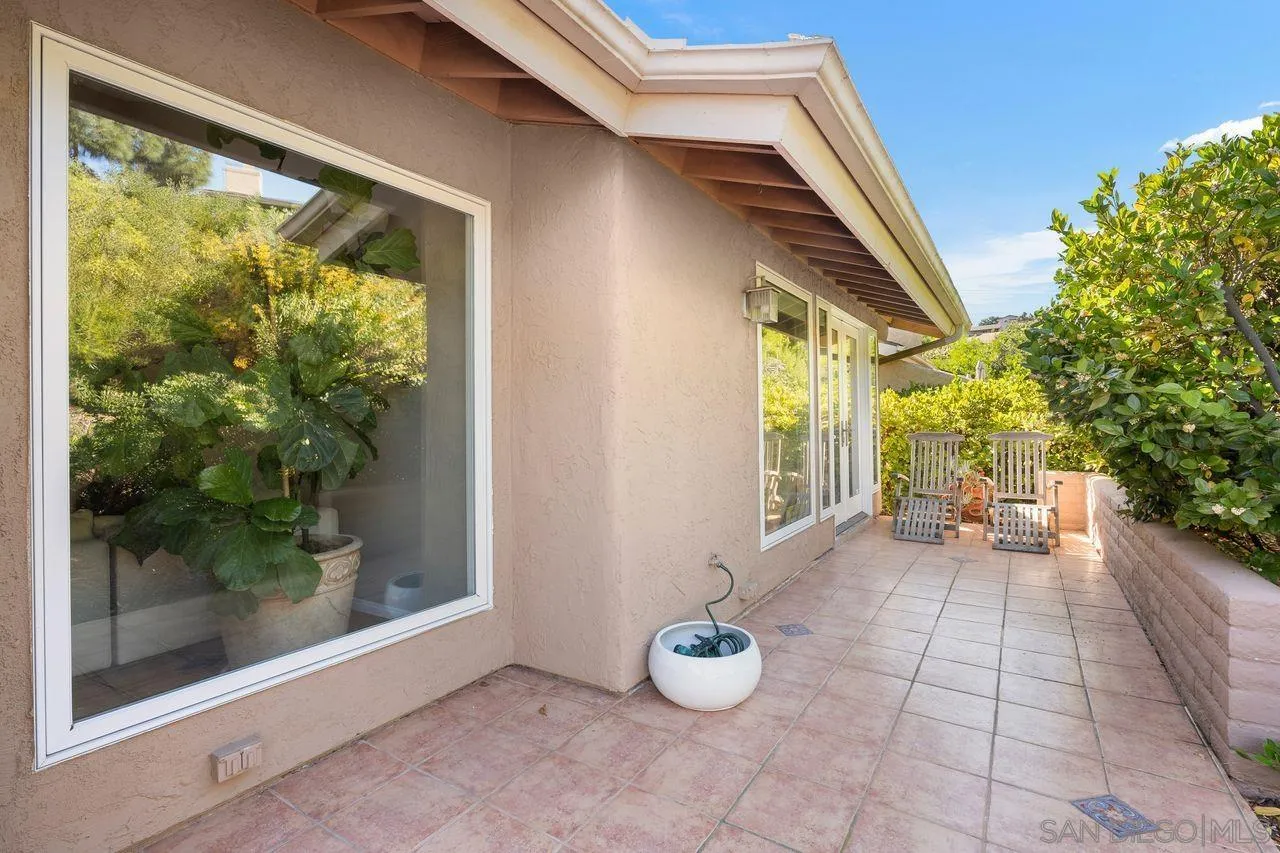 2224 Caminito Cabala La Jolla, CA 92037 - Photo 15 of 36 a view of a porch with chairs and potted plants
