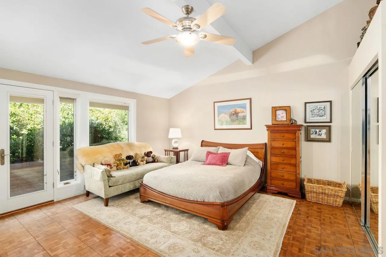2224 Caminito Cabala La Jolla, CA 92037 - Photo 18 of 36 a bedroom with furniture and a large window