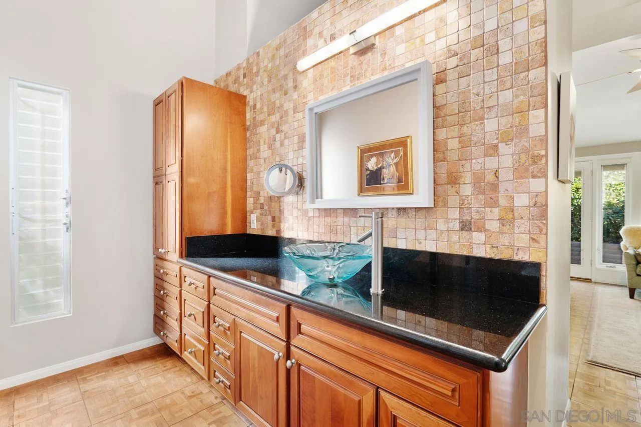 2224 Caminito Cabala La Jolla, CA 92037 - Photo 20 of 36 a kitchen with stainless steel appliances a stove and a microwave
