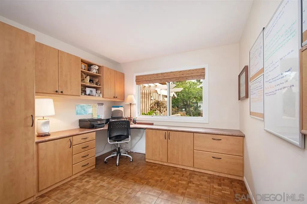 2224 Caminito Cabala La Jolla, CA 92037 - Photo 23 of 36 a kitchen with white cabinets and window
