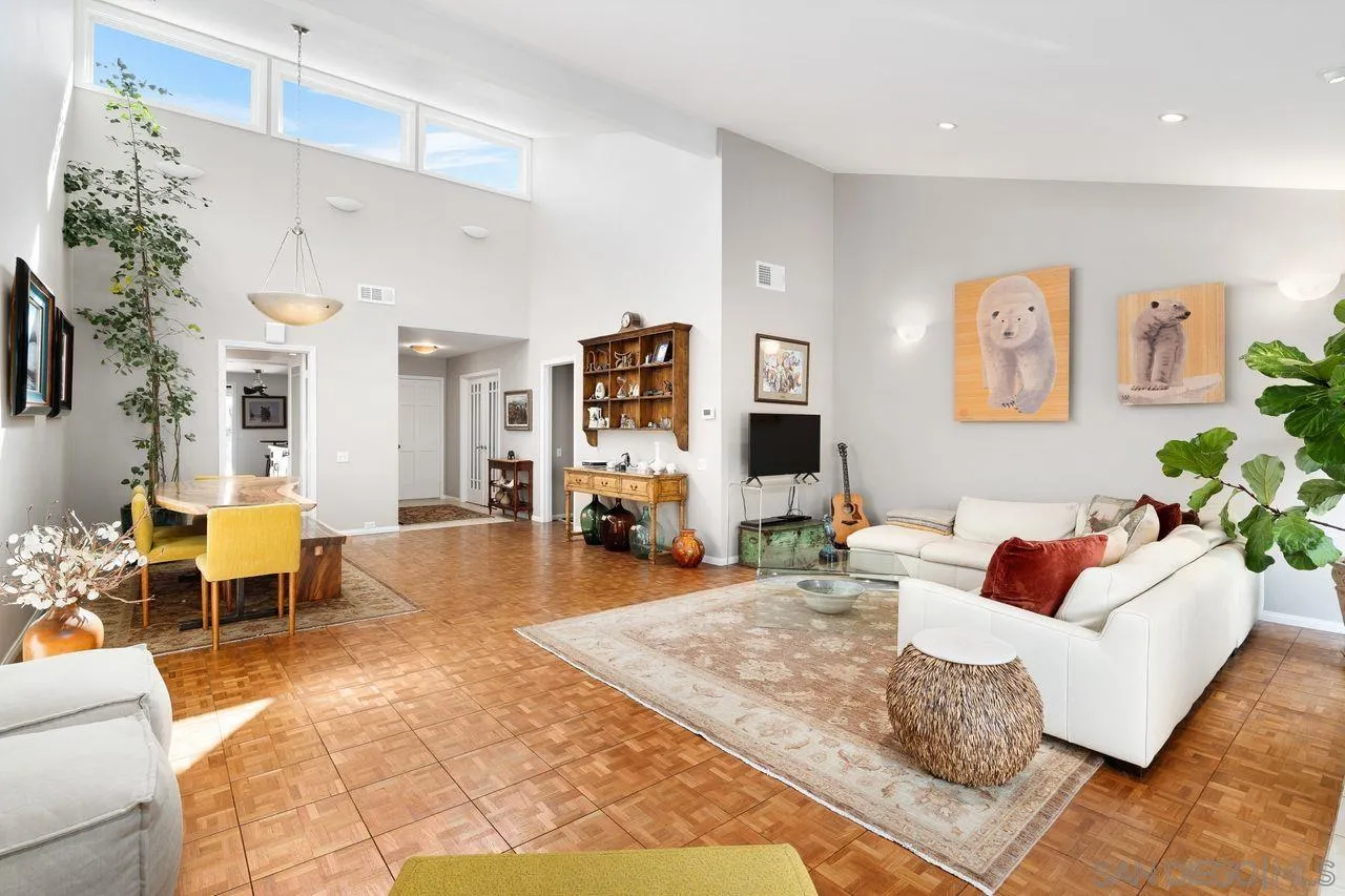 2224 Caminito Cabala La Jolla, CA 92037 - Photo 4 of 36 a living room with furniture fireplace and a flat screen tv