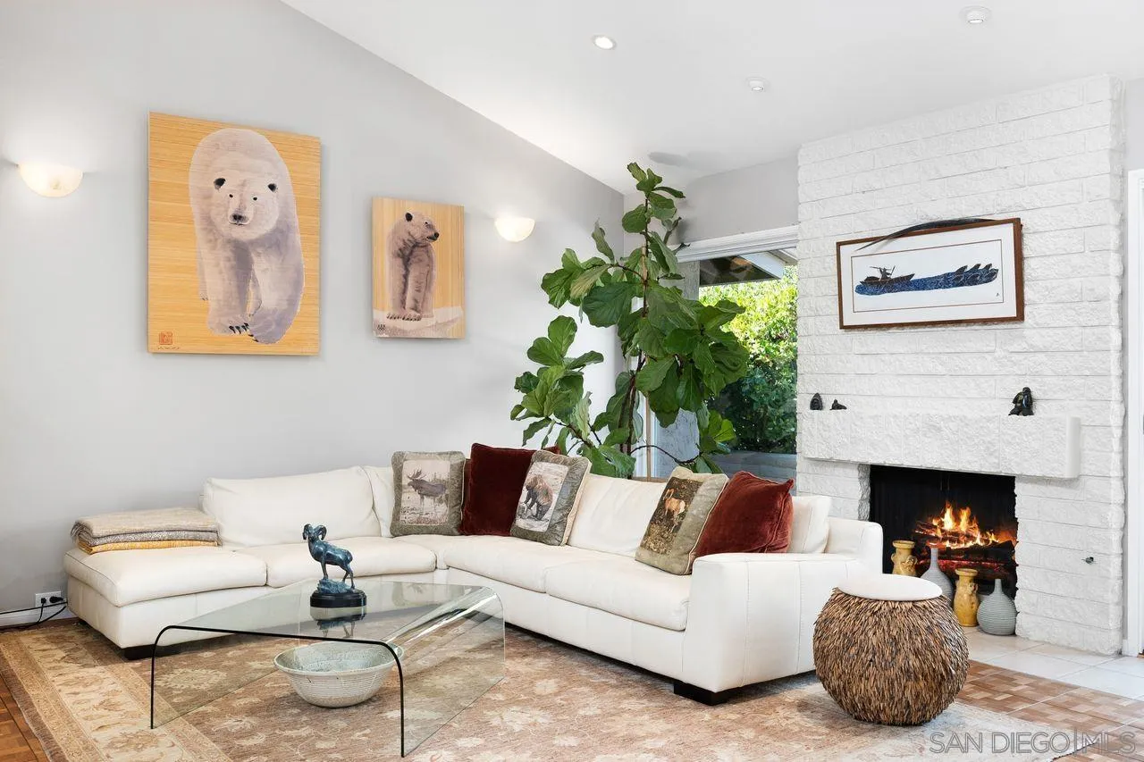 2224 Caminito Cabala La Jolla, CA 92037 - Photo 5 of 36 a living room with furniture and a fireplace