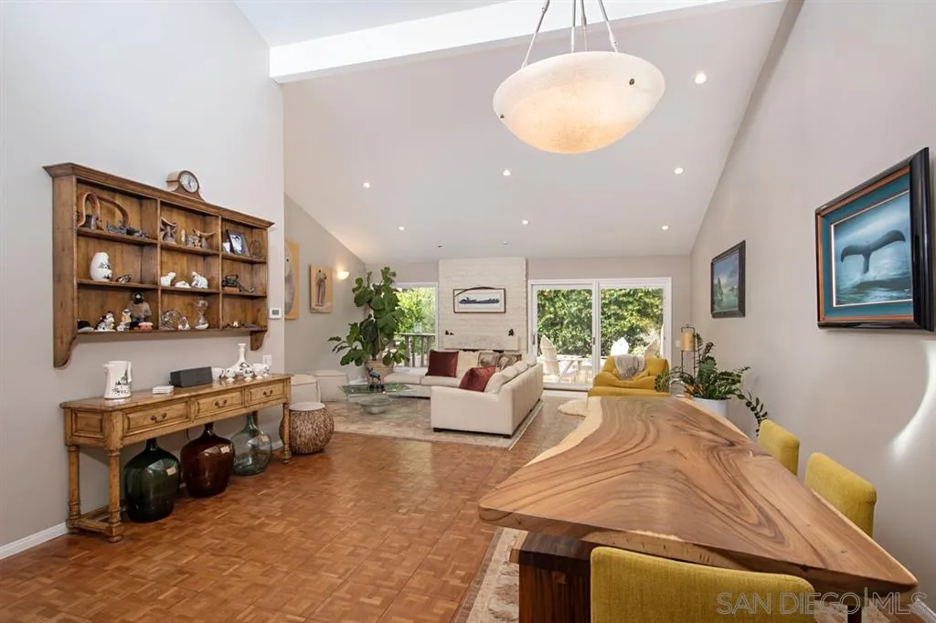 2224 Caminito Cabala La Jolla, CA 92037 - Photo 7 of 36 a living room with furniture a chandelier and a large window