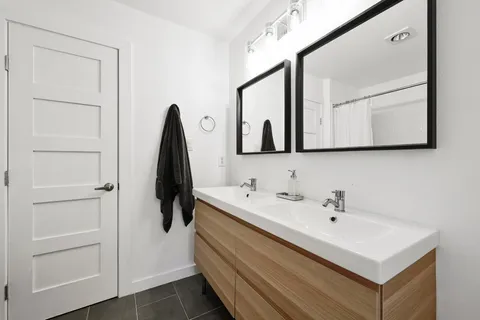 a bathroom with a sink and mirror