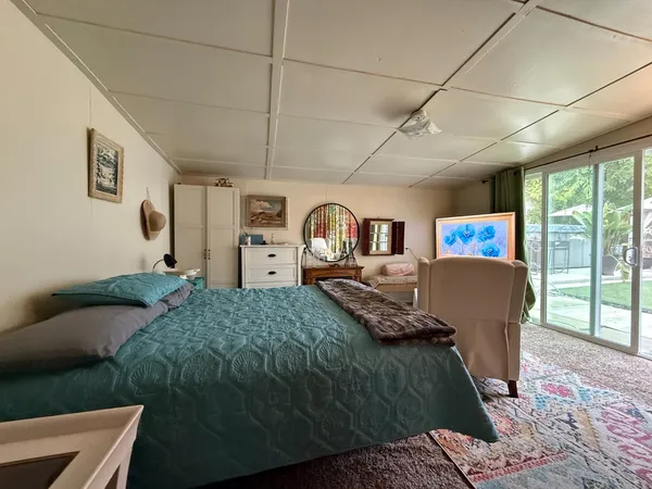 a bed room with bed and a night stand