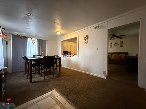 a bathroom with a sink a toilet and shower curtain