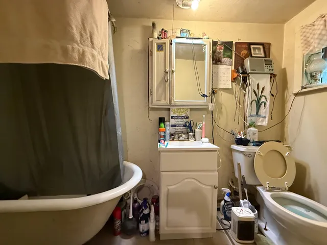 a bed room with a bed and a television