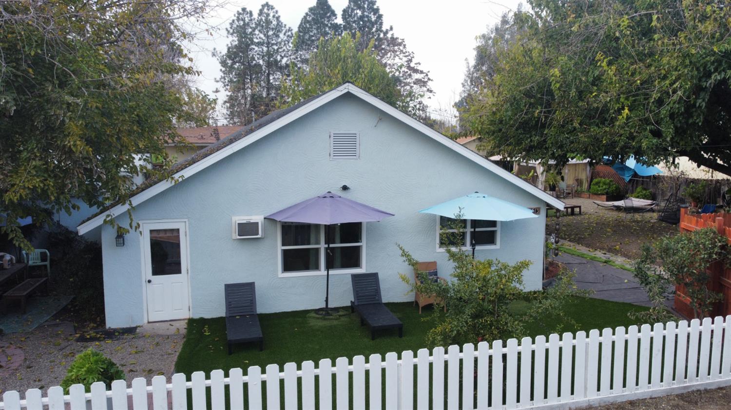 4621 Swanson Road Denair, CA 95316 - Photo 3 of 57 a front view of a house with a garden