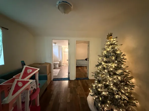 a front view of house with a garden and patio