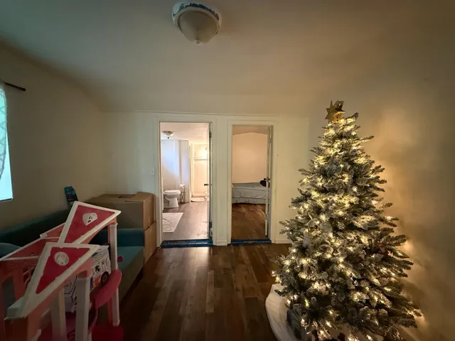 a front view of house with a garden and patio