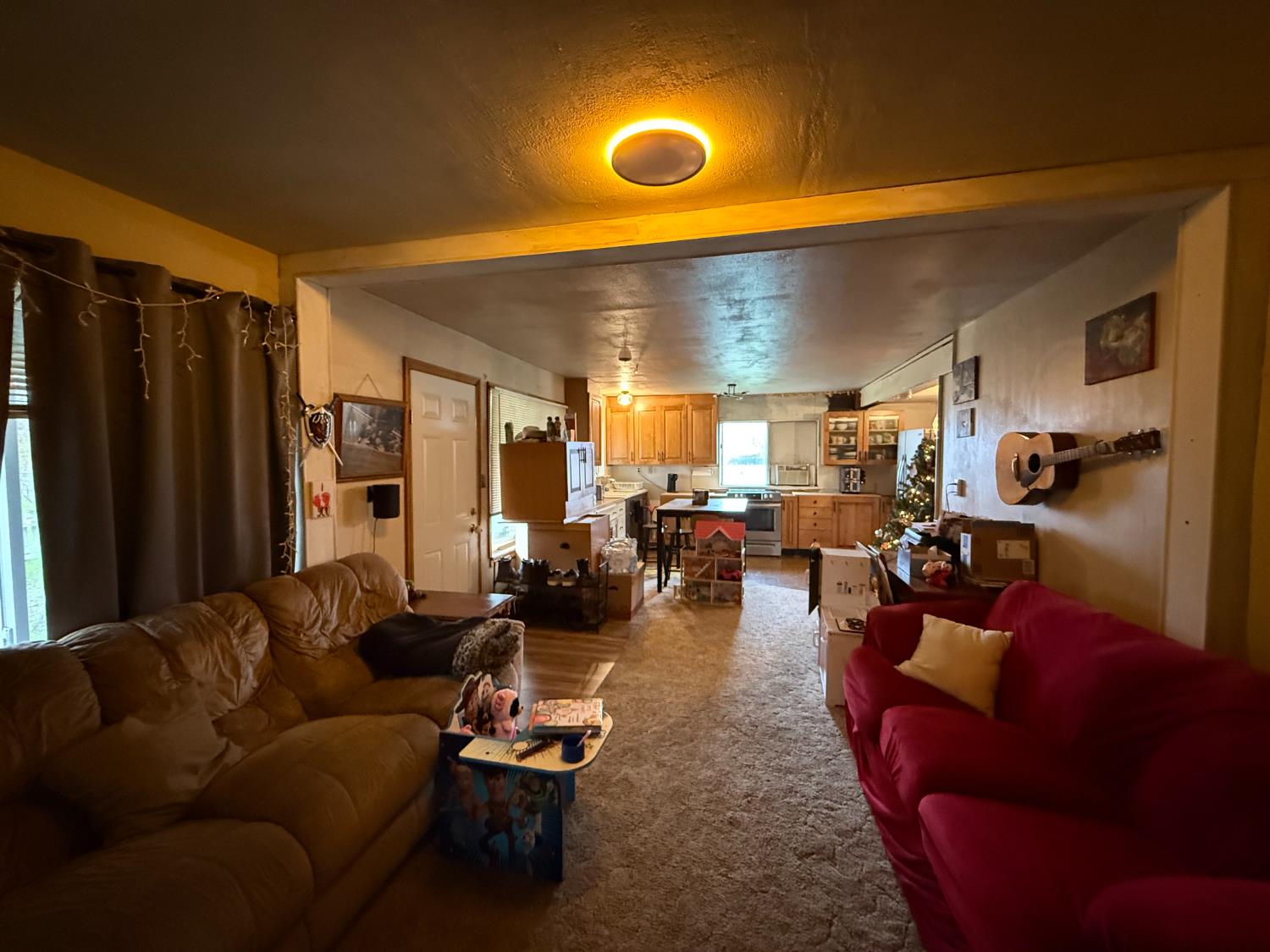 4621 Swanson Road Denair, CA 95316 - Photo 38 of 57 a living room with furniture kitchen view and a large window