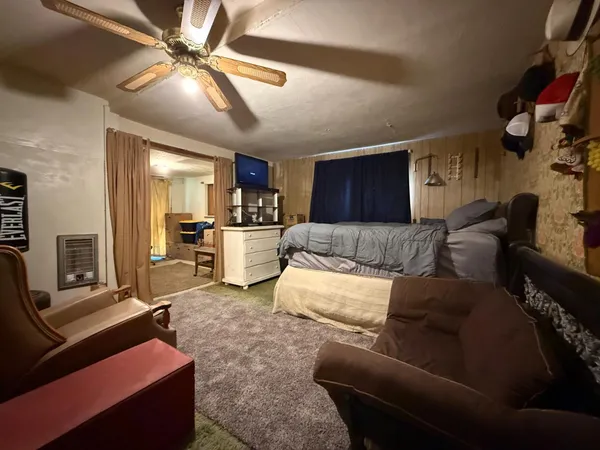 a kitchen with a refrigerator and a sink
