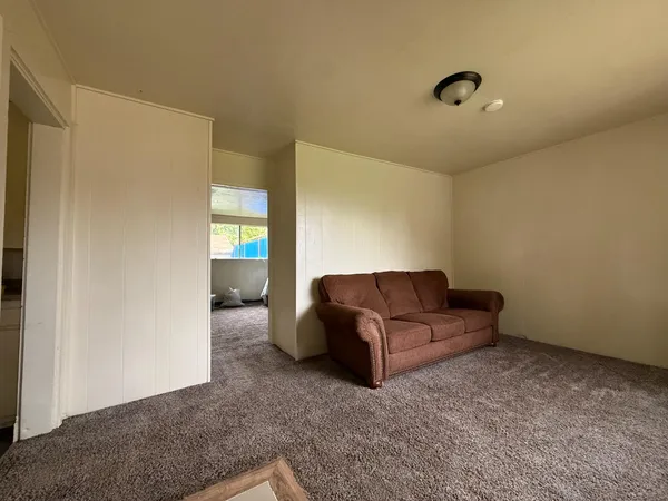 a bed room with furniture and a couch