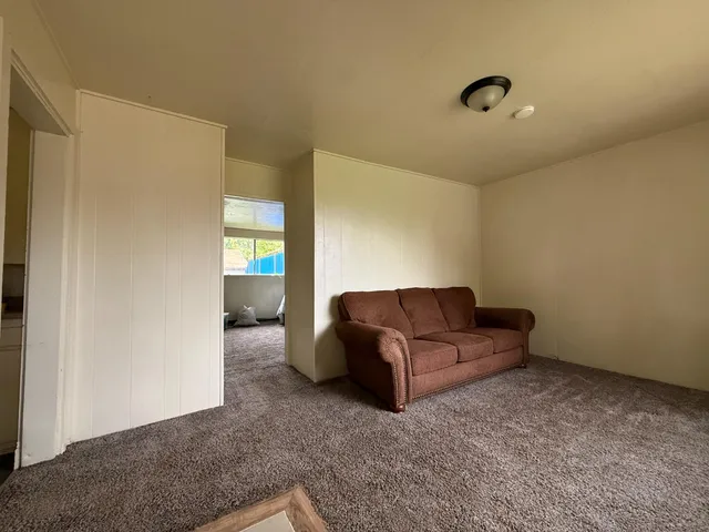 a bed room with furniture and a couch