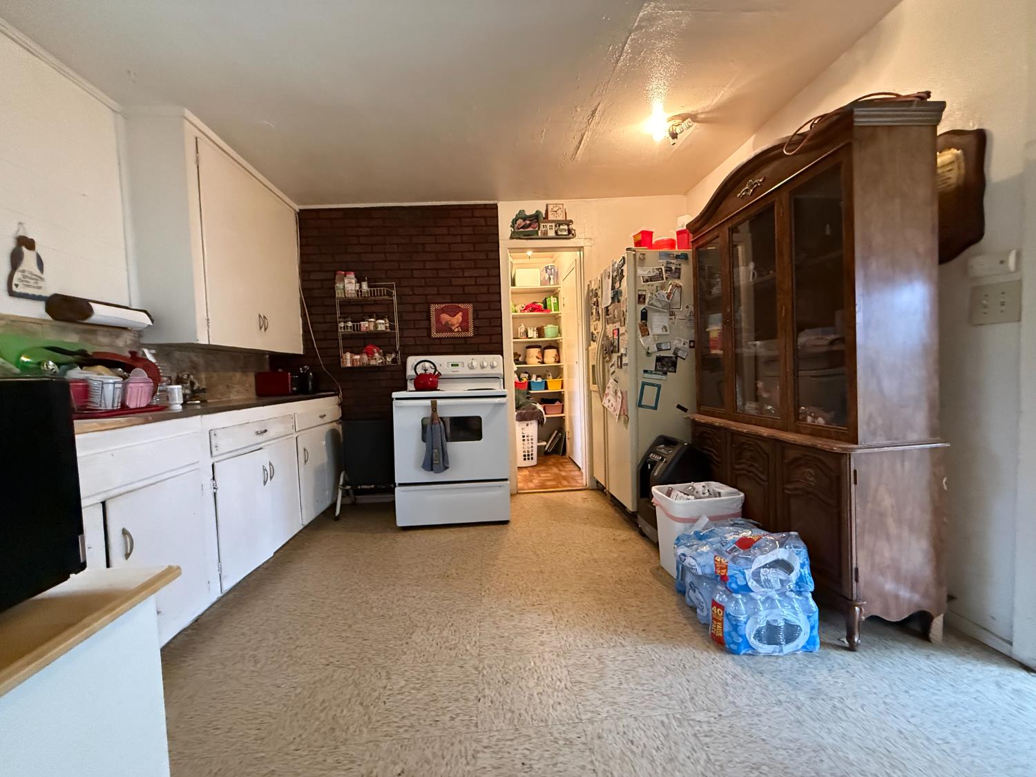4621 Swanson Road Denair, CA 95316 - Photo 51 of 57 a kitchen with stainless steel appliances kitchen island granite countertop a refrigerator and a stove top oven