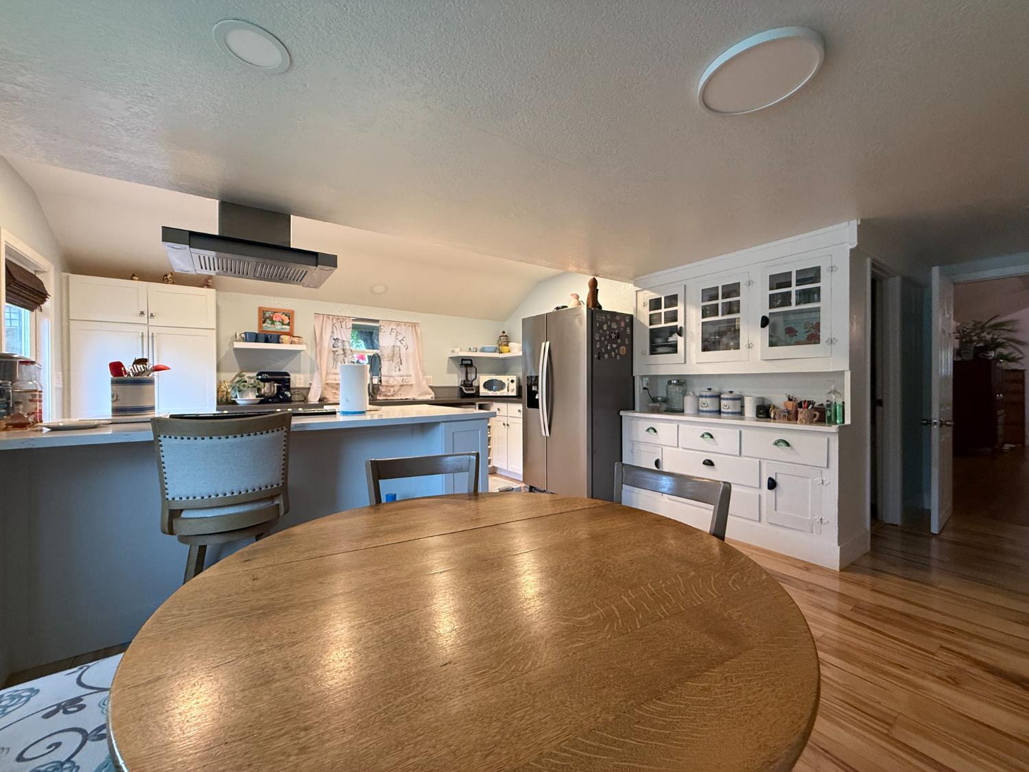 4621 Swanson Road Denair, CA 95316 - Photo 6 of 57 a kitchen with stainless steel appliances a refrigerator and wooden cabinets
