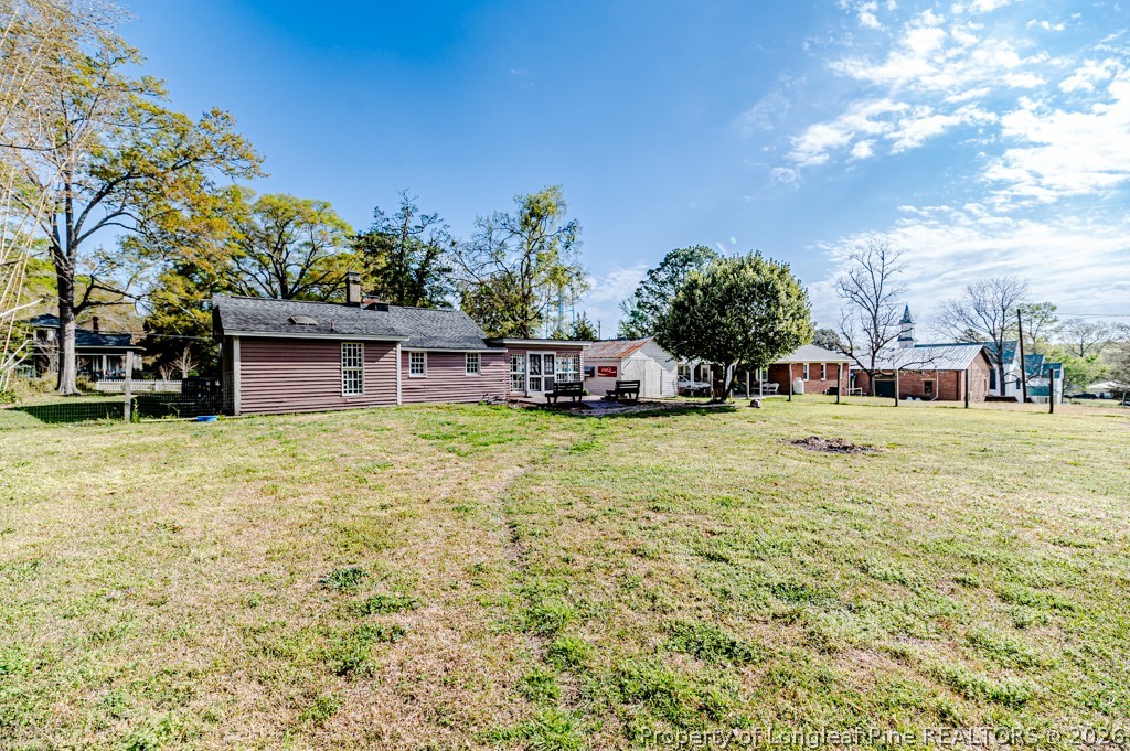 509 Carthage Street Cameron, NC 28326 - Photo 37 of 43 a view of a house with a yard