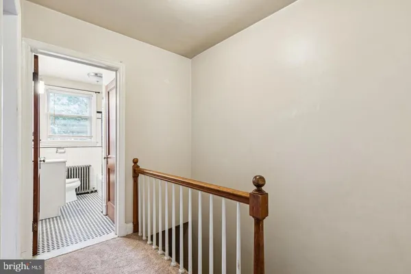 a view of a bedroom from a hallway