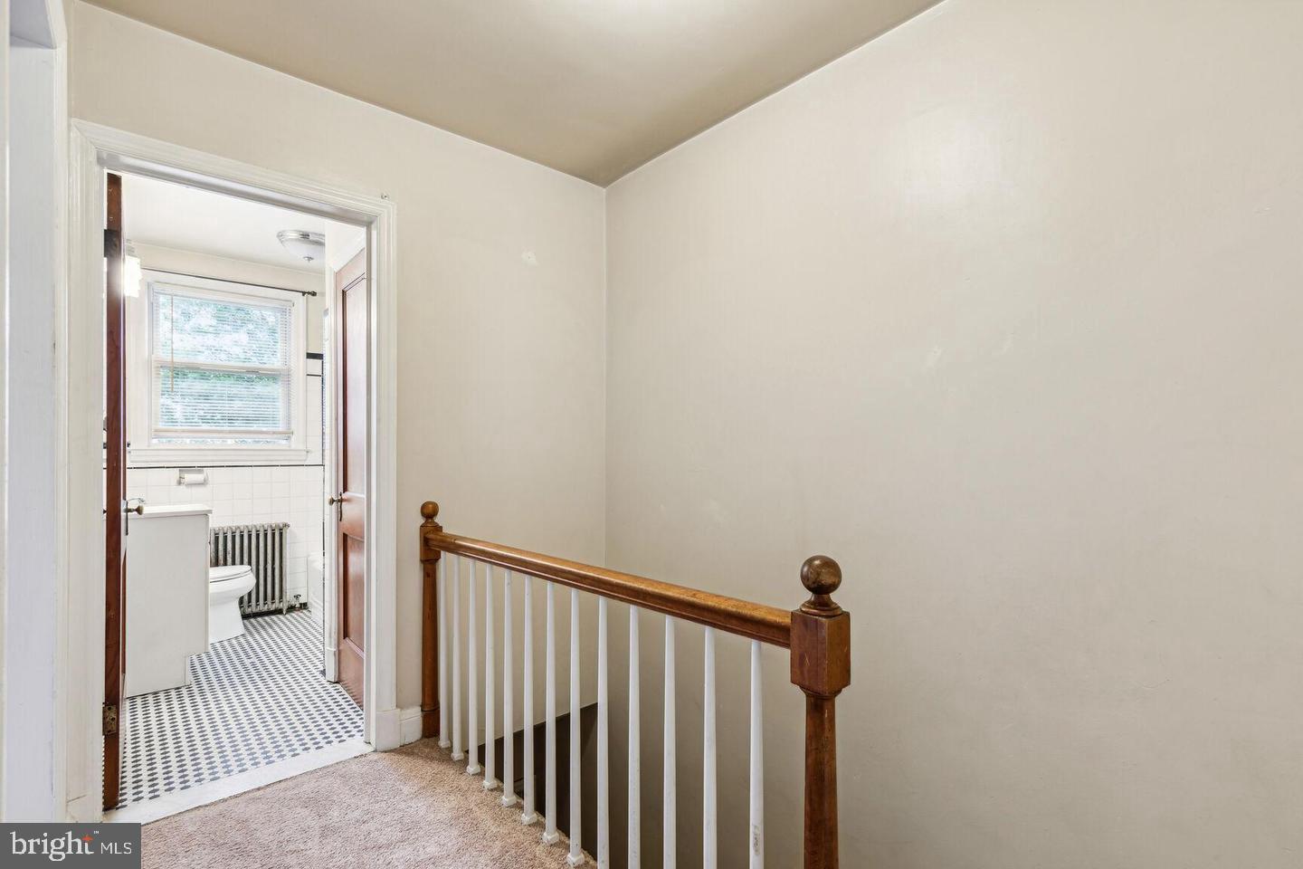 902 Elm Ridge Avenue Baltimore, MD 21229 - Photo 7 of 15 a view of a bedroom from a hallway