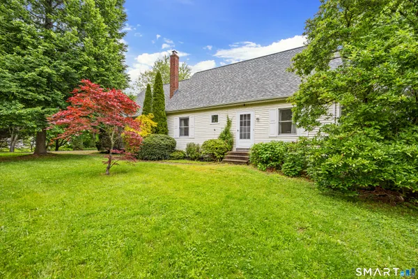 a house with a tree in front of it