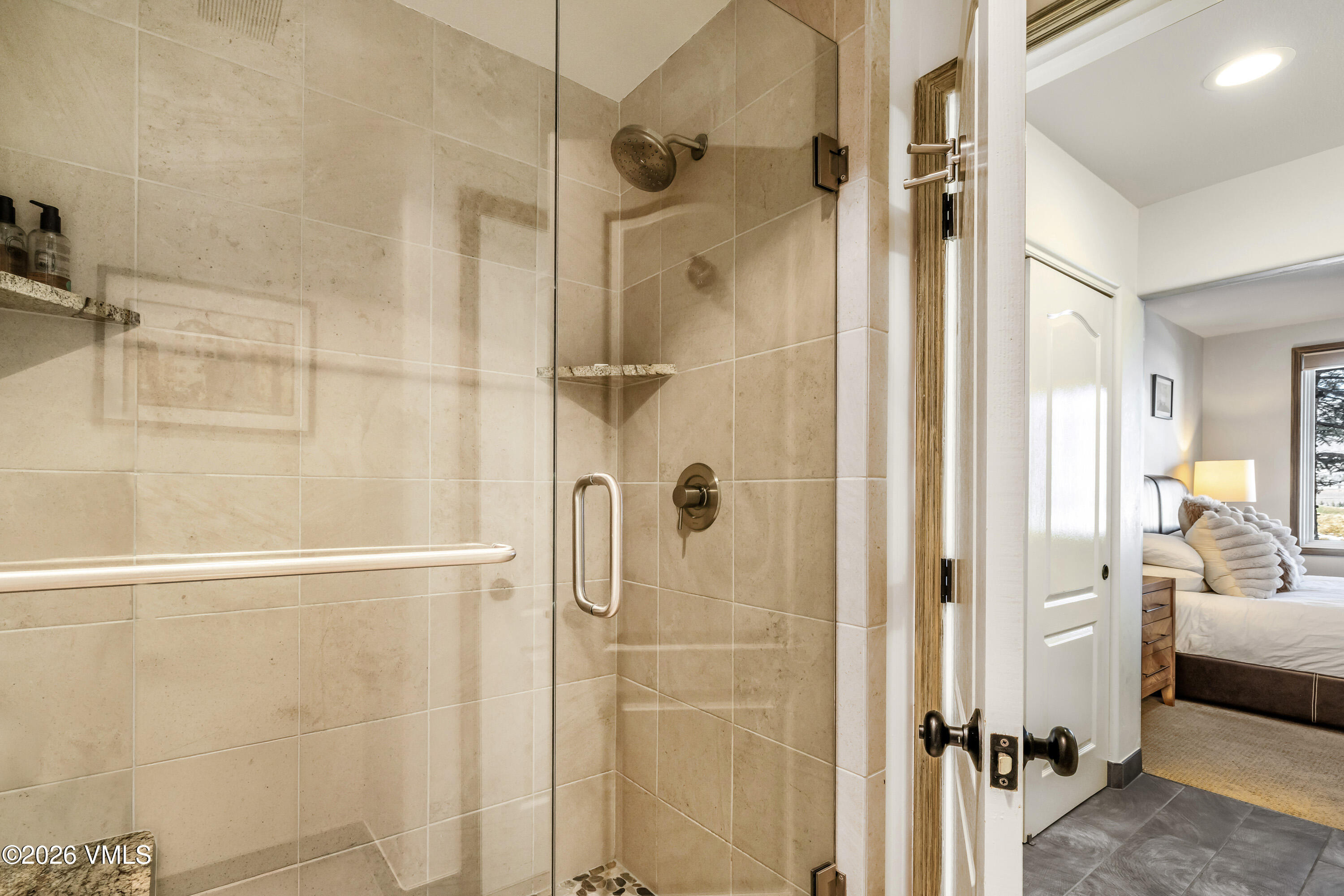 600 Sawatch Drive, Unit 101 Edwards, CO 81632 - Photo 15 of 34 a bathroom with a glass shower door