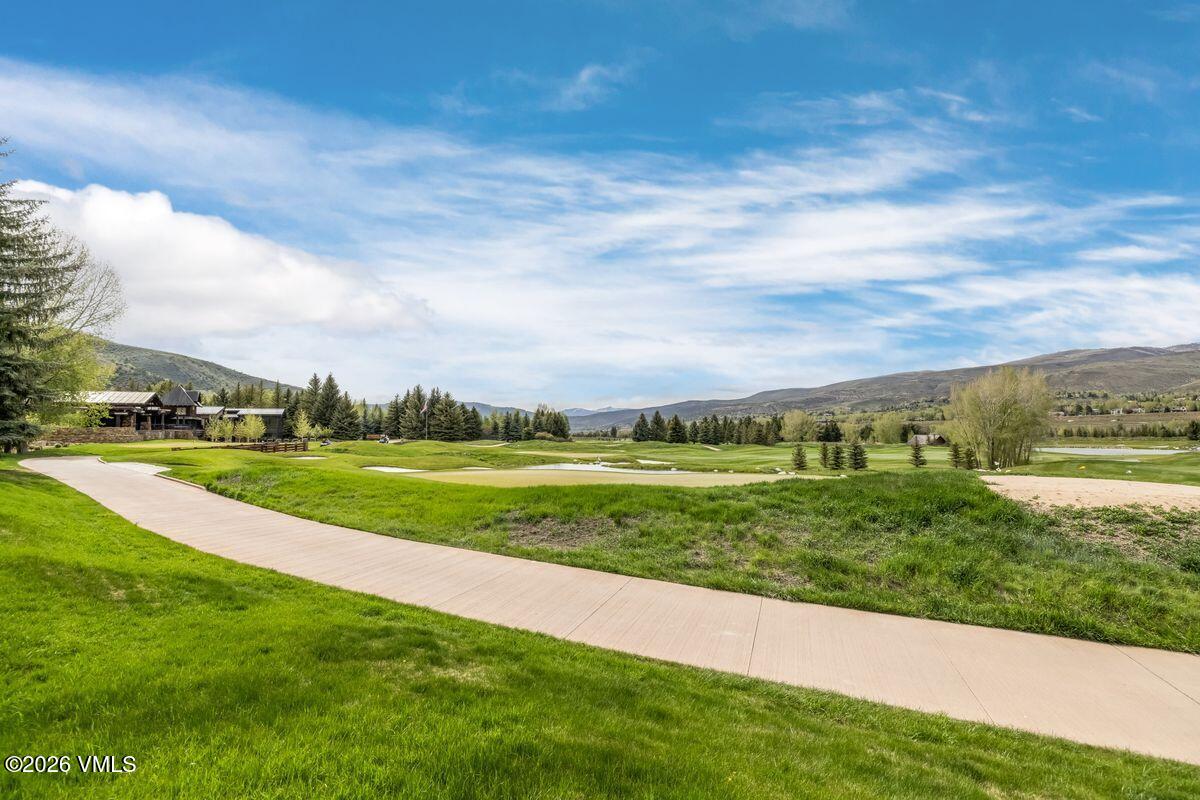 600 Sawatch Drive, Unit 101 Edwards, CO 81632 - Photo 25 of 34 a view of a golf course with a lake