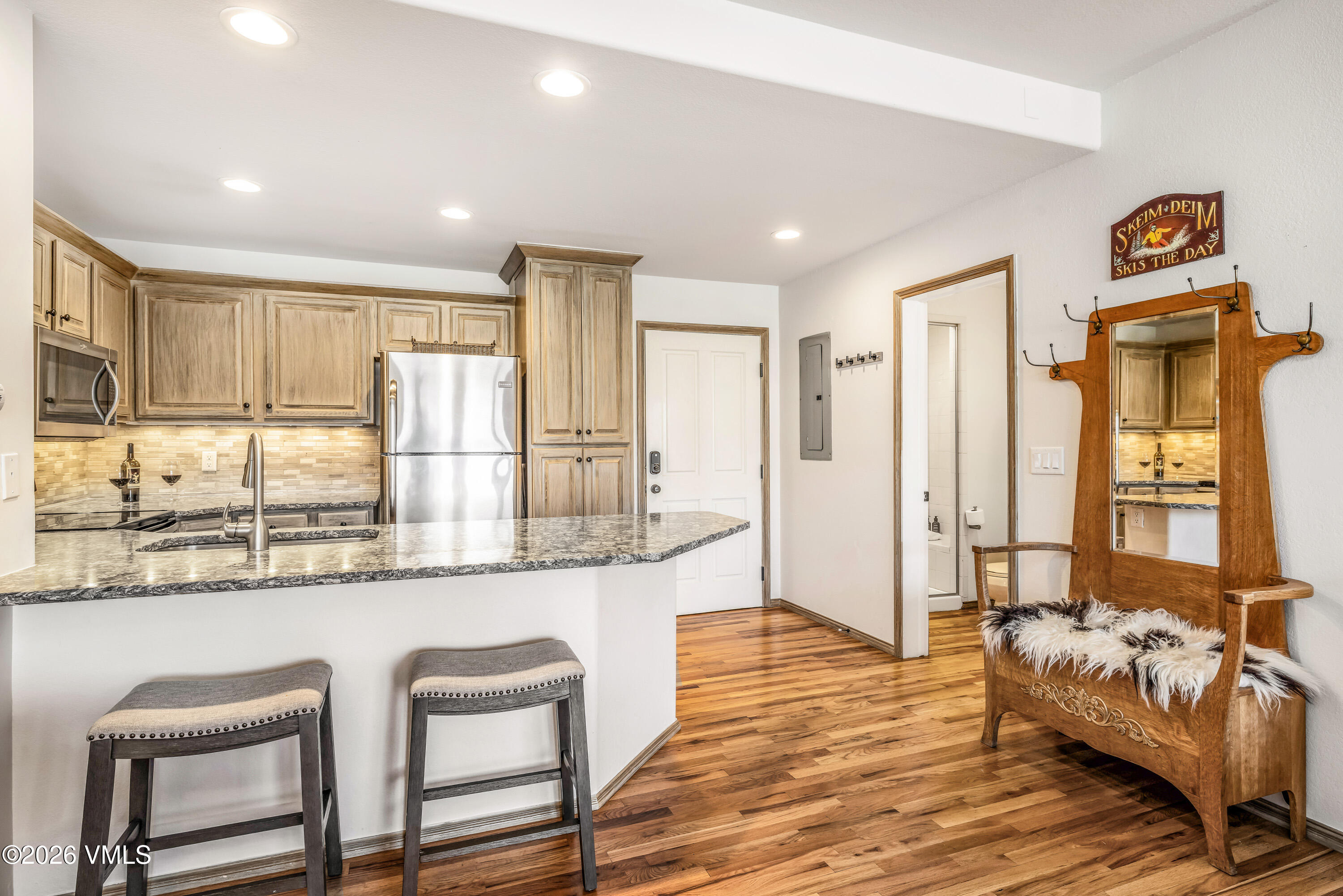 600 Sawatch Drive, Unit 101 Edwards, CO 81632 - Photo 34 of 34 a living room with stainless steel appliances granite countertop furniture and a wooden floor