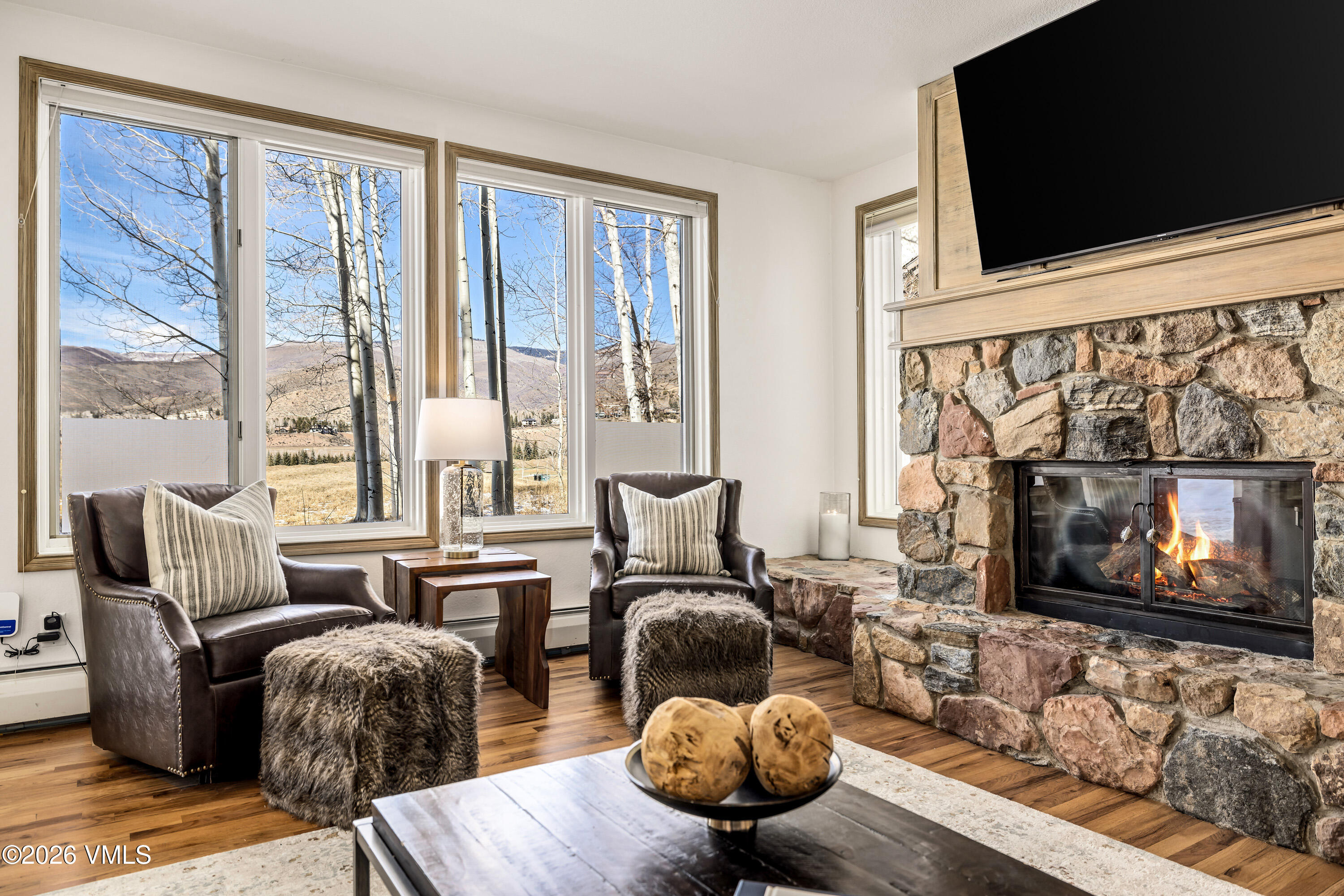 600 Sawatch Drive, Unit 101 Edwards, CO 81632 - Photo 9 of 34 a living room with furniture fireplace and flat screen tv