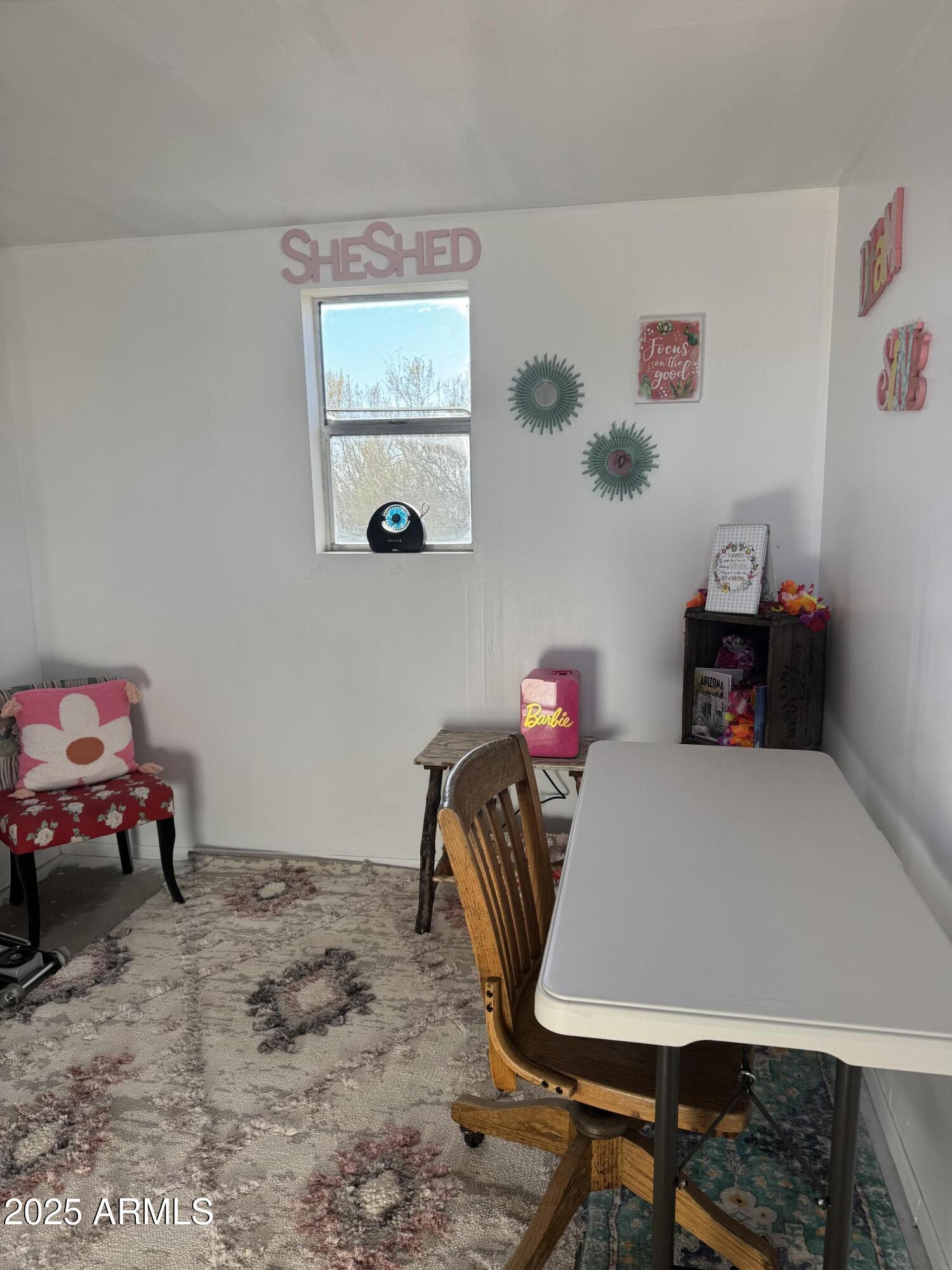 30530 Burnt Sage Road, Unit 278 Congress, AZ 85332 - Photo 3 of 13 a room with a table and chairs
