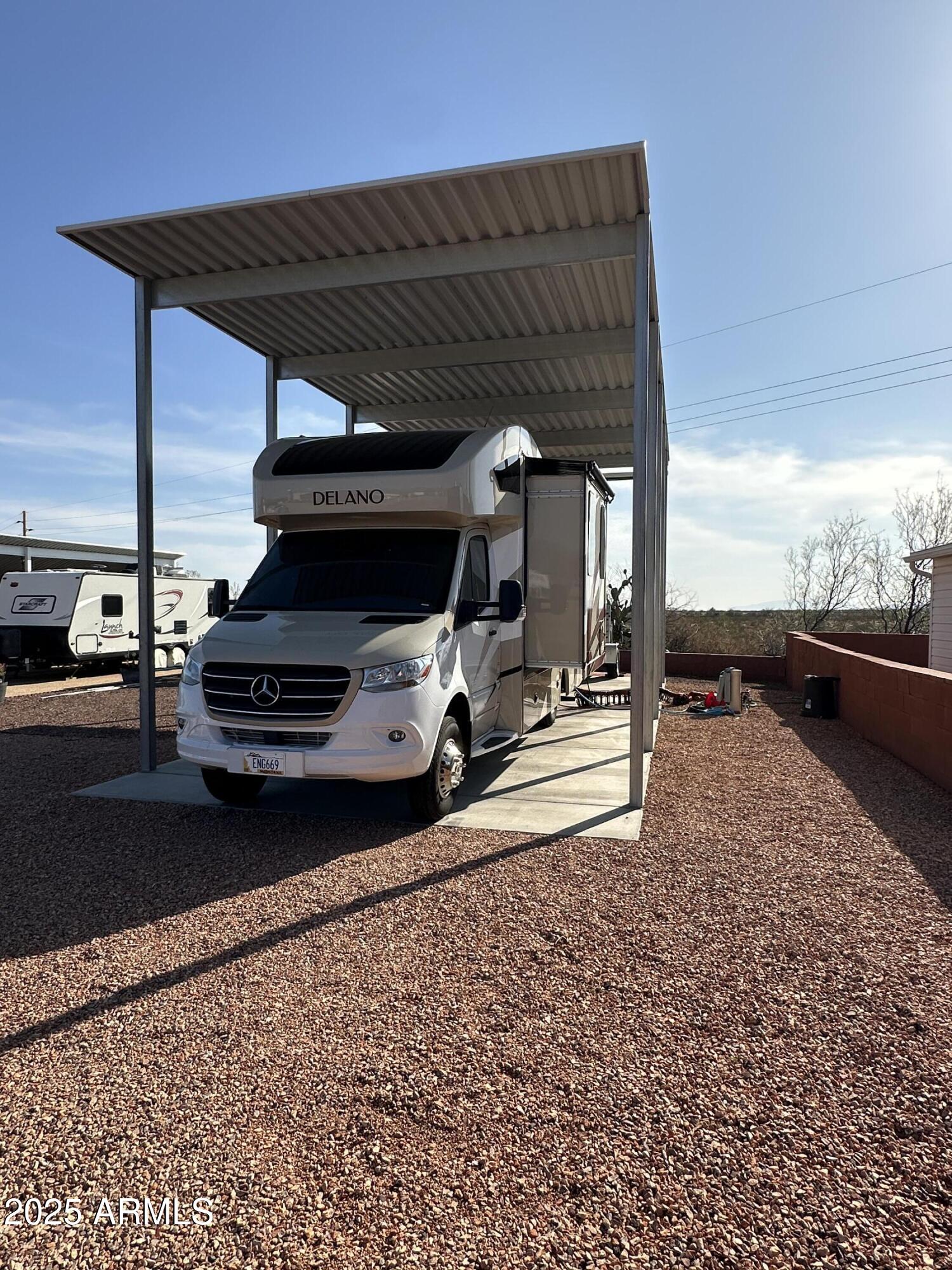 30530 Burnt Sage Road, Unit 278 Congress, AZ 85332 - Photo 4 of 13 a view of car parked in garage