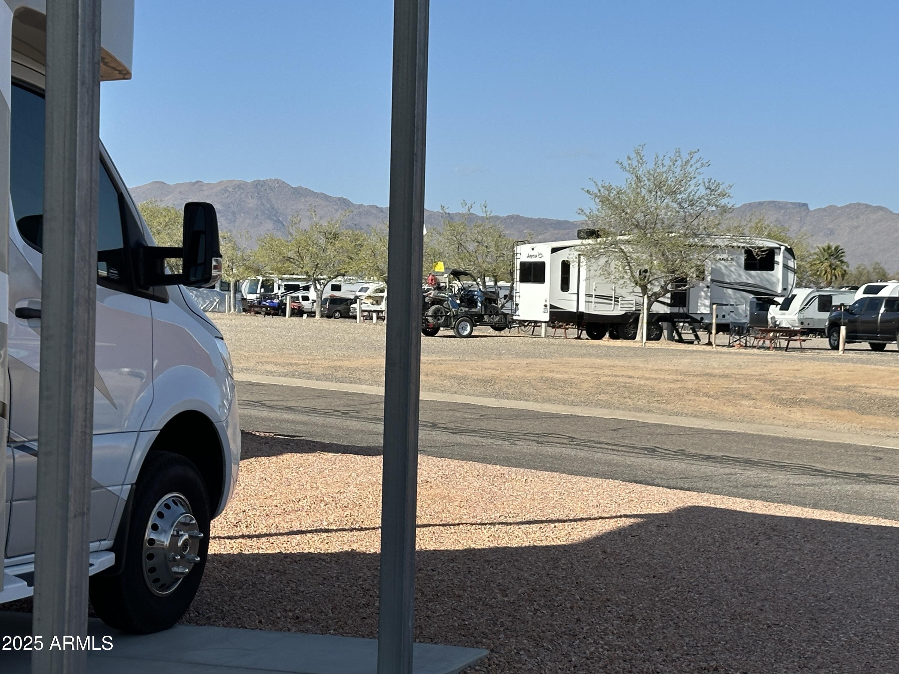 30530 Burnt Sage Road, Unit 278 Congress, AZ 85332 - Photo 7 of 13 a view of living room with furniture and a fireplace