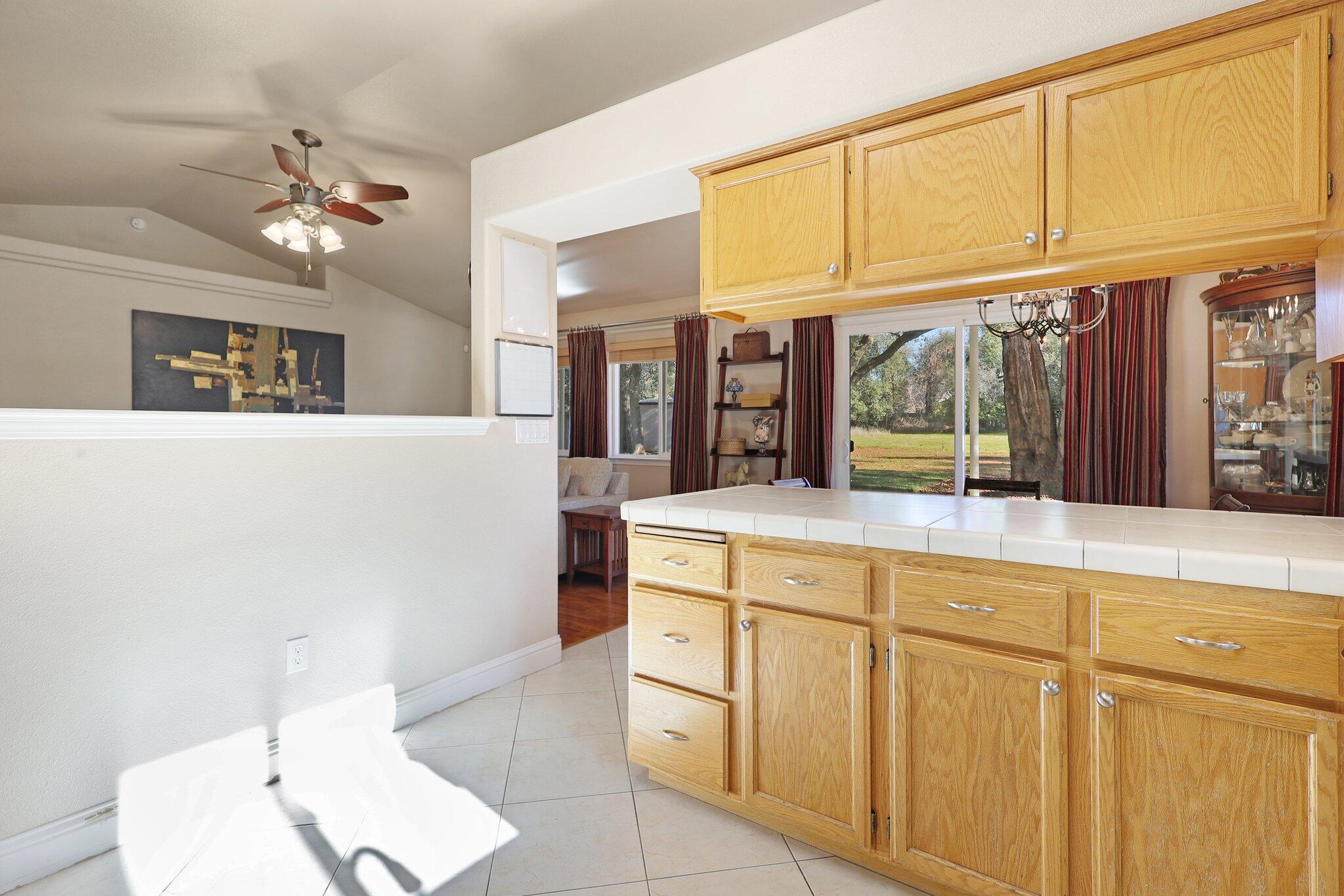 3375 Lawrence Road Redding, CA 96002 - Photo 13 of 46 a kitchen with cabinets and window