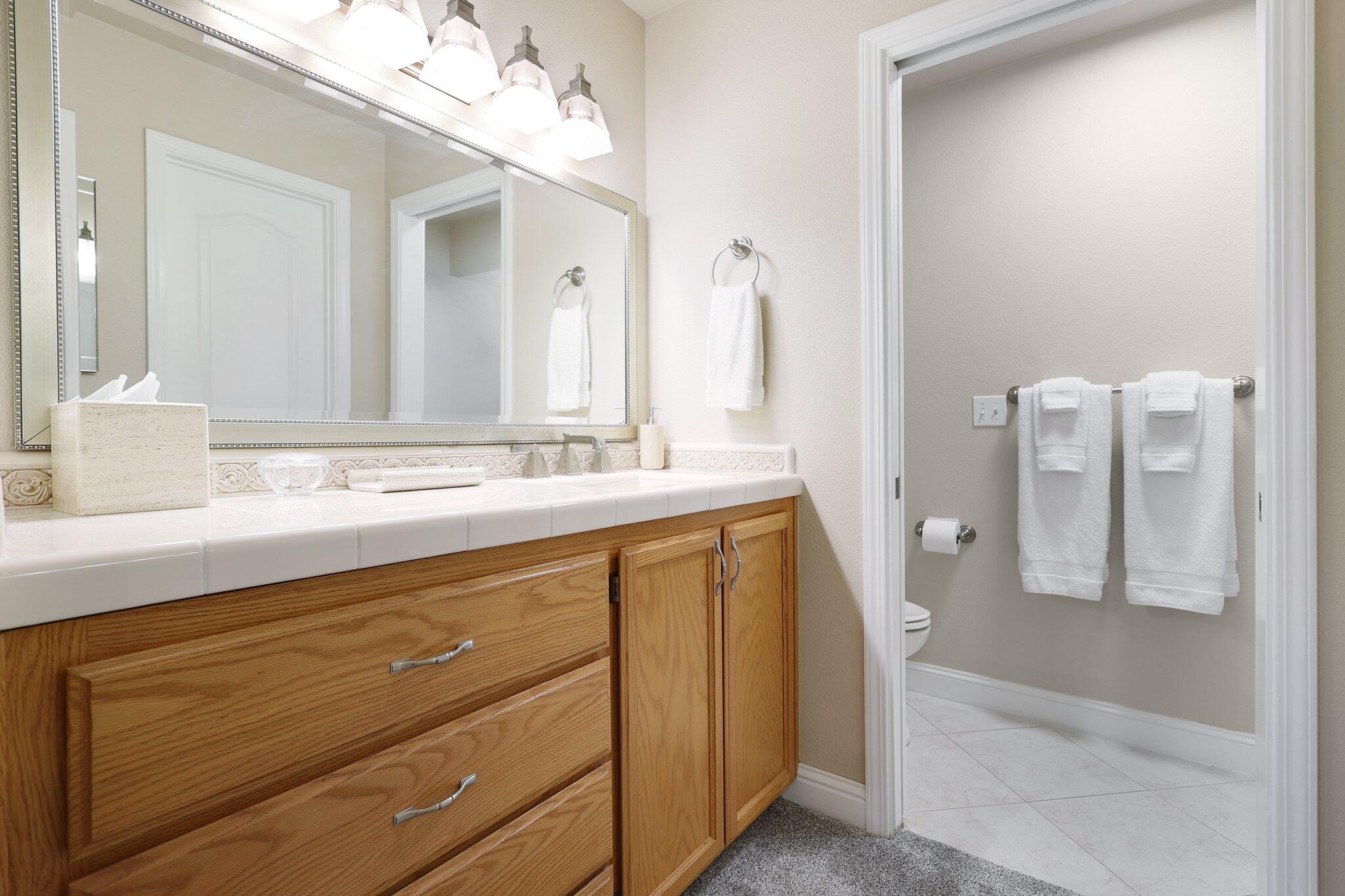 3375 Lawrence Road Redding, CA 96002 - Photo 17 of 46 a bathroom with a sink a mirror and a shower