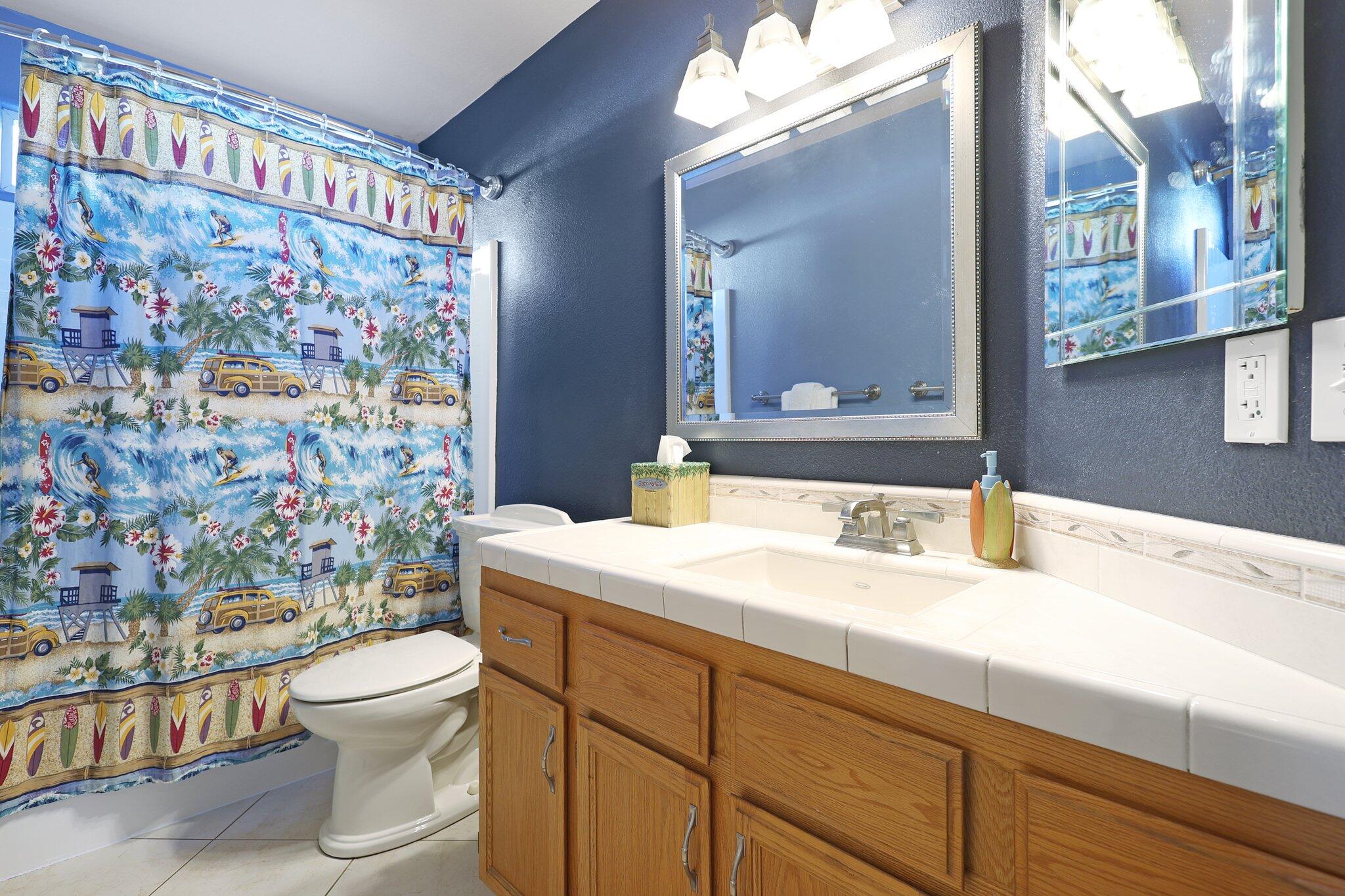 3375 Lawrence Road Redding, CA 96002 - Photo 19 of 46 a bathroom with a sink a toilet and shower curtain
