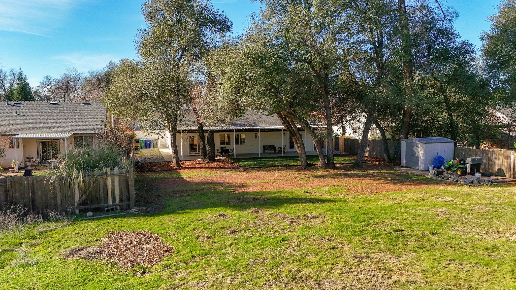 3375 Lawrence Road Redding, CA 96002 - Photo 25 of 46 a view of a house with swimming pool and sitting area