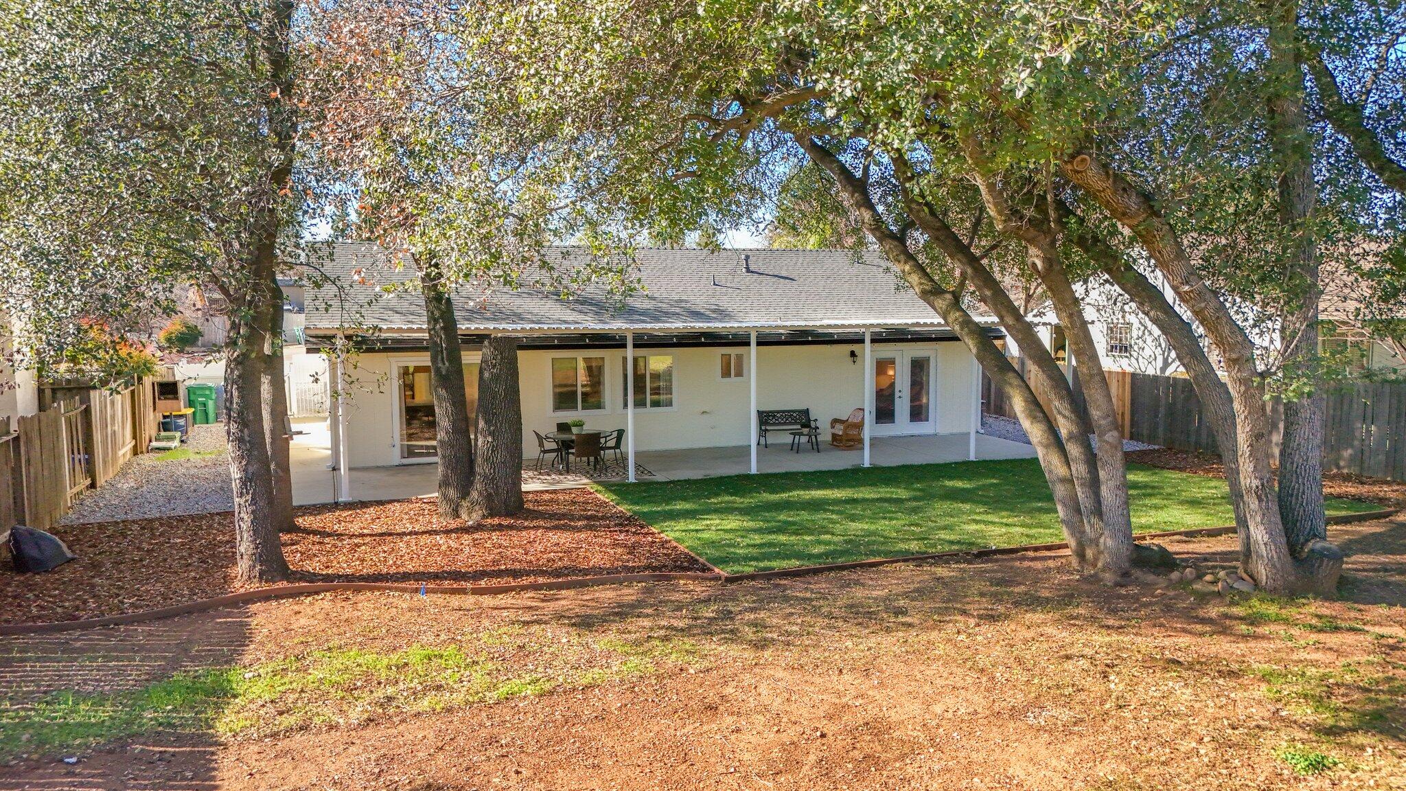 3375 Lawrence Road Redding, CA 96002 - Photo 26 of 46 a front view of a house with a porch
