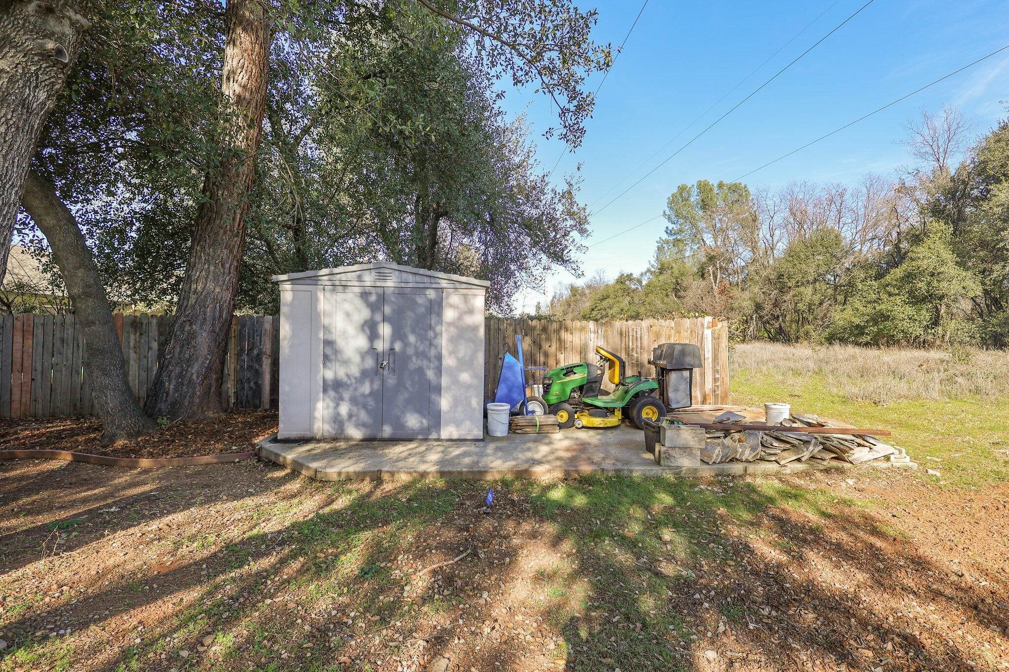 3375 Lawrence Road Redding, CA 96002 - Photo 27 of 46 a view of a park with large trees and wooden fence
