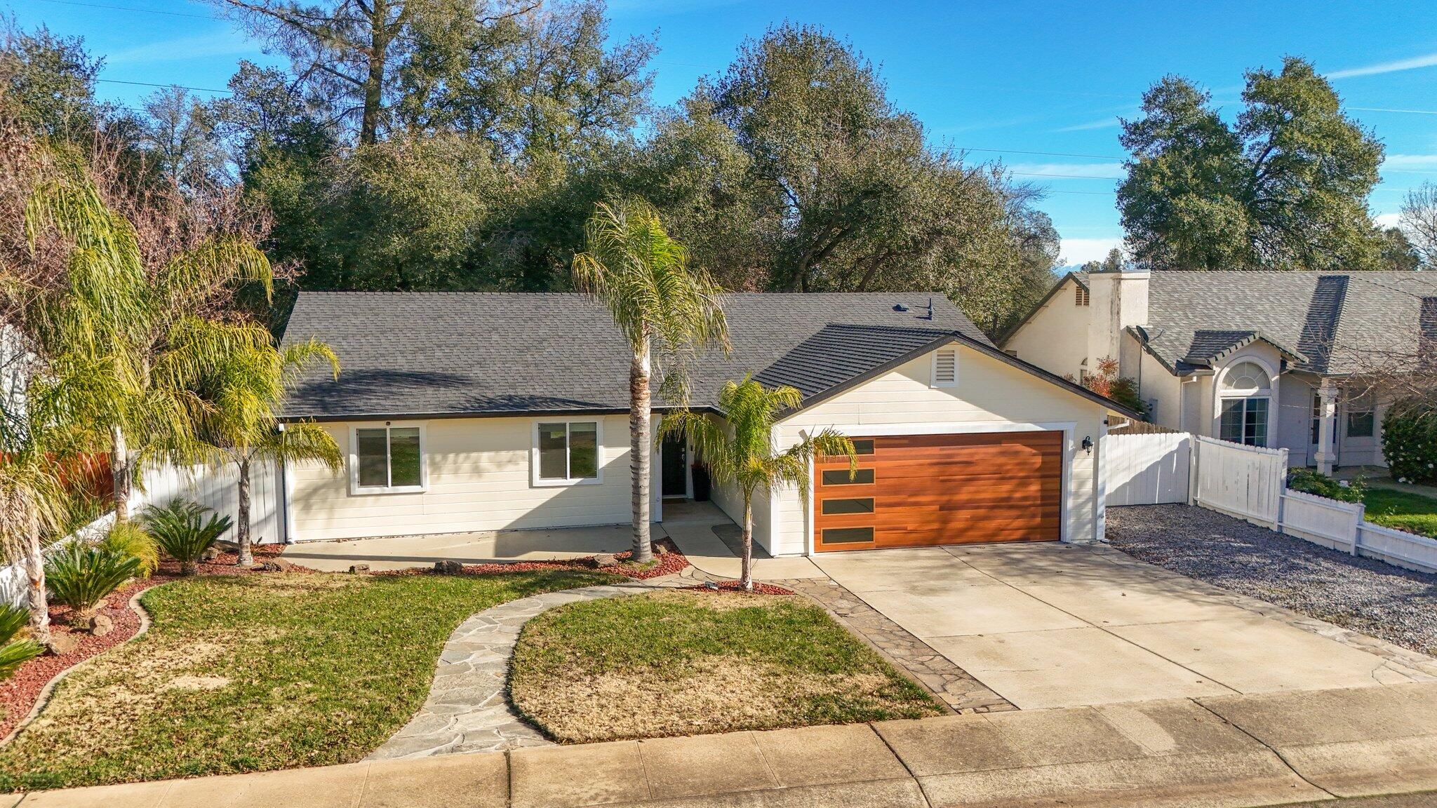 3375 Lawrence Road Redding, CA 96002 - Photo 39 of 46 front view of a house with a yard