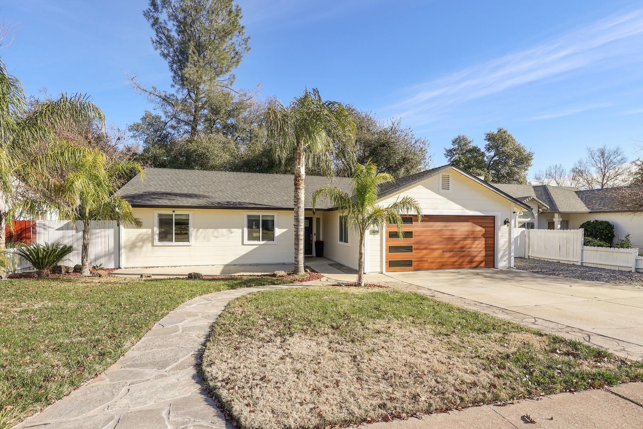 3375 Lawrence Road Redding, CA 96002 - Photo 45 of 46 a front view of a house with a yard and garage