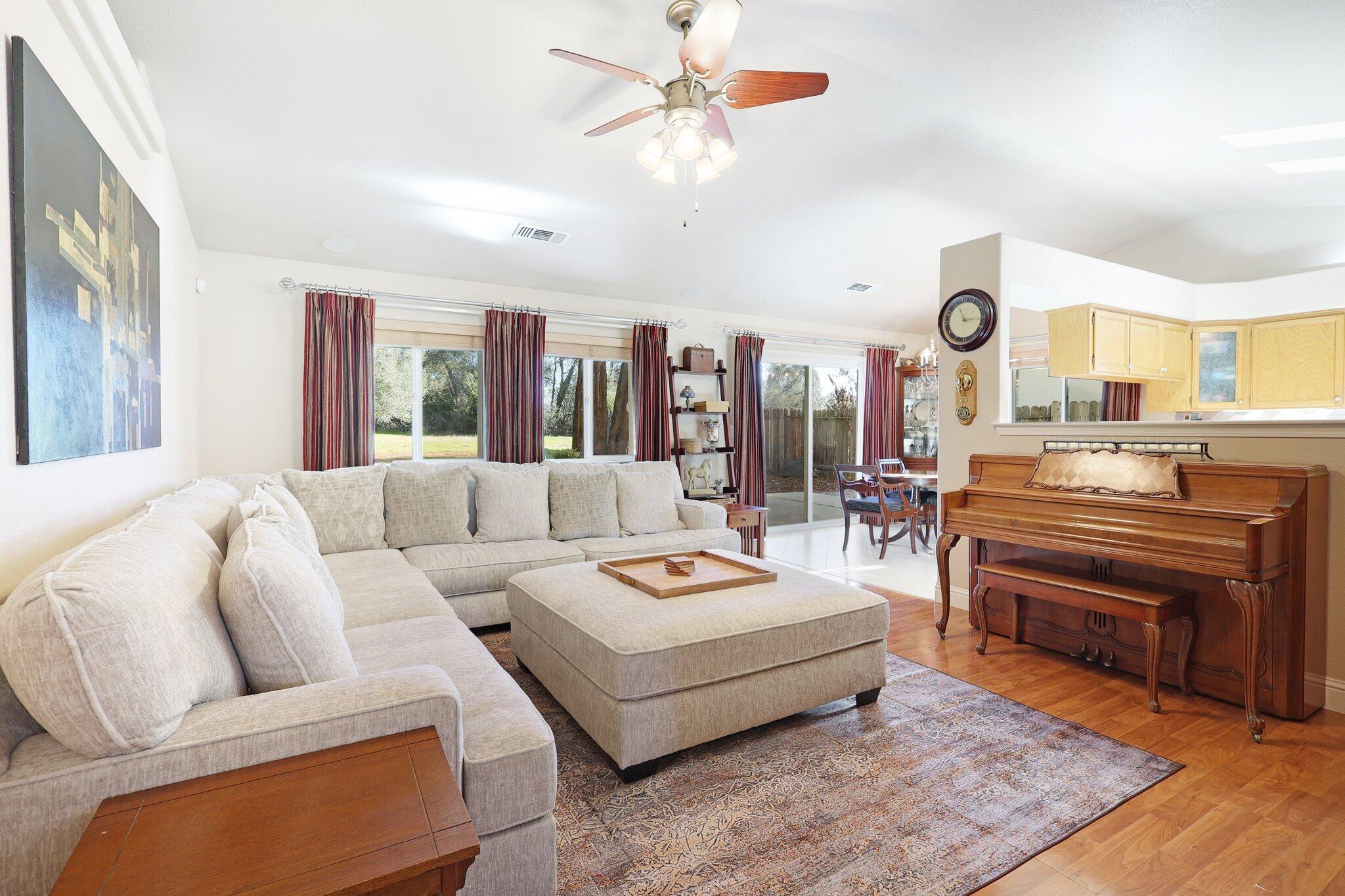 3375 Lawrence Road Redding, CA 96002 - Photo 8 of 46 a living room with furniture and wooden floor
